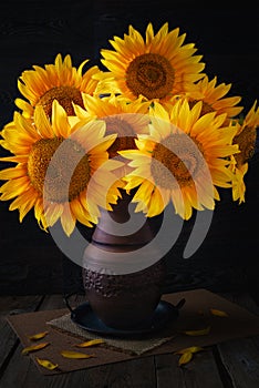 Still life with a bouquet of sunflowers in a vase