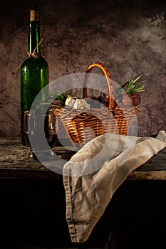 Still life bread in basket and bottle o