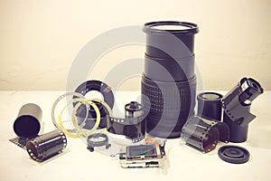 Still life with broken camera lens, camera film, Cmos sensor, to