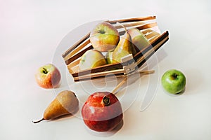 Still life with a bunch of apples and a basket