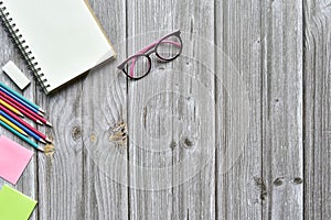 Still life, business office supplies or education concept, Top view image of open notebook and various colorful pencil