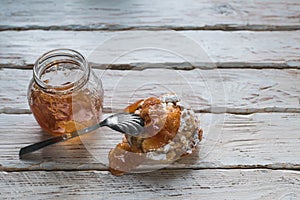 Still life of a cake and jam jar
