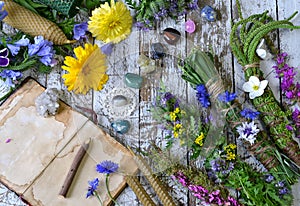 Still life with calendula flowers, herbs, reiki crystals on witch table