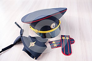 Still Life: cap, tie and epaulettes police