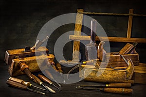 Still life with carpentry tools, bench planes , wood carving chisel