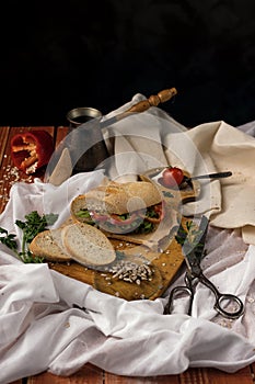 Still life. Cezve, cherry tomato branch, bread, fork