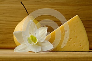 Still life with cheese and pear