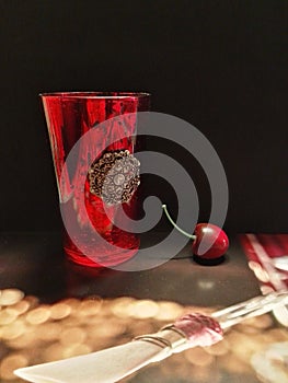 Red vintage glass and cherry at the party. photo