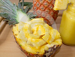 Still life. Close-up. Pineapple juice, cocktails with fresh pineapple for breakfast in the morthe morning on a wooden tray. Detox.