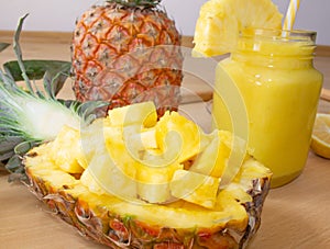 Still life. Close-up. Pineapple juice, cocktails with fresh pineapple for breakfast in the morthe morning on a wooden tray. Detox.