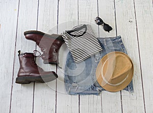 Still life of clothes, denim mini skirt, striped t-shirt and hat