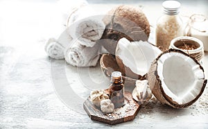 Still life with coconut oil in a bottle and fresh coconut