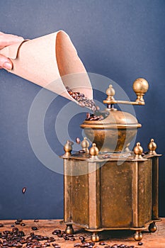 Still life with coffee beans and old coffee grinder