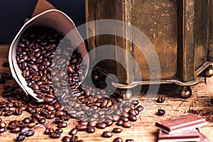 Still life with coffee beans and old coffee grinder