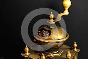 Still life with coffee beans and old coffee grinder