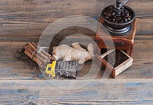 still life with coffee beans and old coffee mill on wooden table