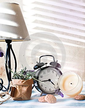 Still life composition with clock