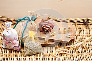 Still life composition with wooden box and small glass bottles