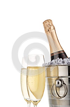 Bottle with champagne and two full wineglasses