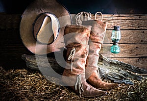 Still life with cowboy hat and traditional leather boots