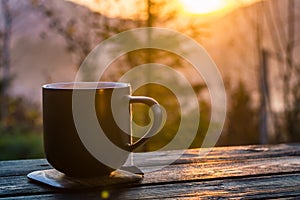 Two cups with coffee on the wooden table