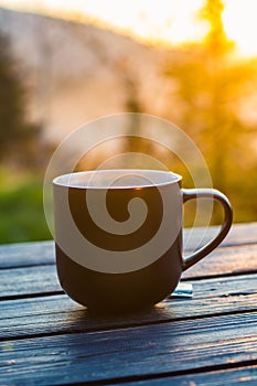 Two cups with coffee on the wooden table