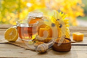 Still life from cup of tea , lemon, honey, wax