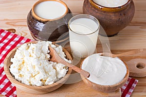 still life with dairy products, milk, eggs, bread and cheese on a vintage background