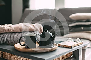 Tea with steam in room in morning sunlight