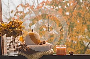 Still life details in home on a wooden window. Autumn decor on a window. Cozy autumn or winter concept.