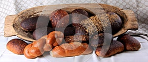 Still life with different types of bread: black, rye, white bread, bread with seeds. bread and wheat ears.