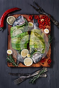 Still life with dorados wrapped in leek photo