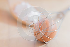 Still life egg in whisk.