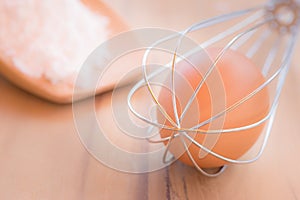 Still life egg in whisk.