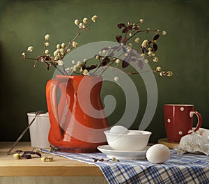 Still life with eggs and red jug