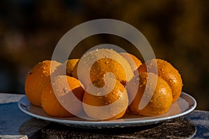 Still life eight oranges on white plate