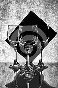 Still life with empty glass goblets `Flowing quadrilateral. photo