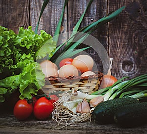 Still life of farm vegetables from the vegetable garden on a wooden background