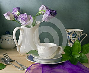 Still life with flowers and dishes