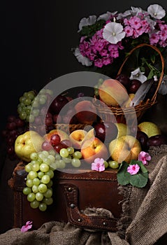 Still life with flowers and fruits in the style of old Dutch artists