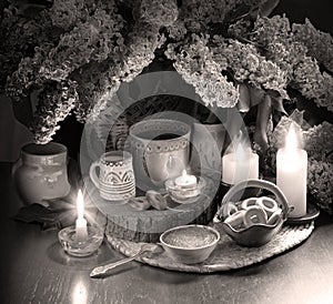 Still life from food and lush lilac boquet