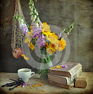 Still life with a foxglove and books