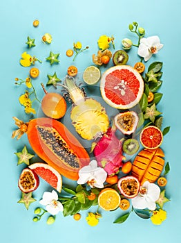 Still life with fresh assorted exotic fruits and flowers