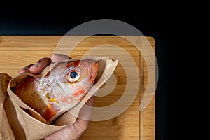 Still life with fresh fish and ingredients for cooking photo