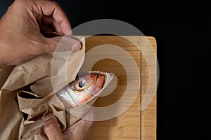 Still life with fresh fish and ingredients for cooking photo