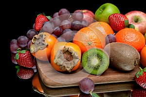 Still life of fresh fruit on a black background