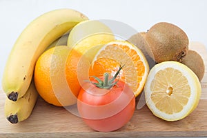 Still life fruit closeup of kiwi, orange, lemon