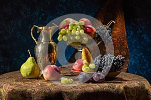 Still life with fruits. Grapes, nectarines, pears and plums.
