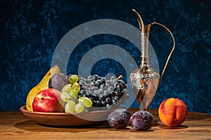 Still life with fruits. Grapes, nectarines, pears and plums.