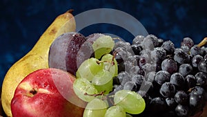 Still life with fruits. Grapes, nectarines, pears and plums.